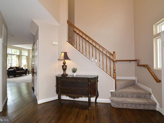 Lovely foyer with refinished hardwood floors.