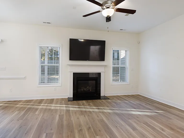 Living room with fireplace and flat screen TV