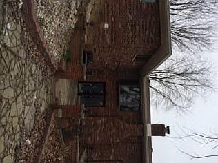 Gorgeous view of back of house with multi level patio areas