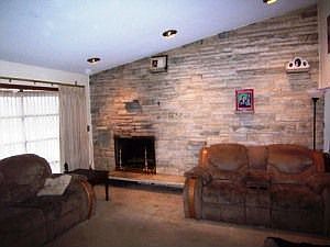 Living room with stone wall fireplace!