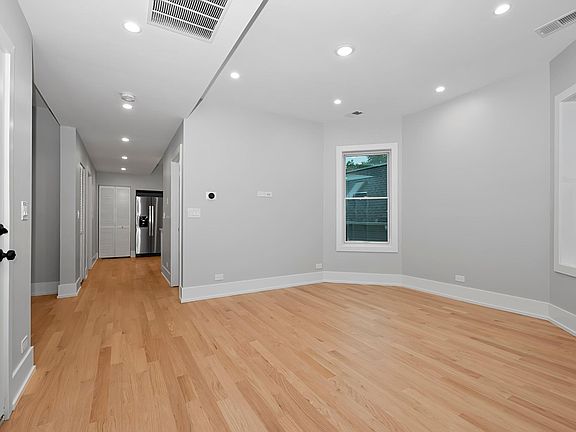 Living Room with Bay, Nest Thermostat, wall ready for TV