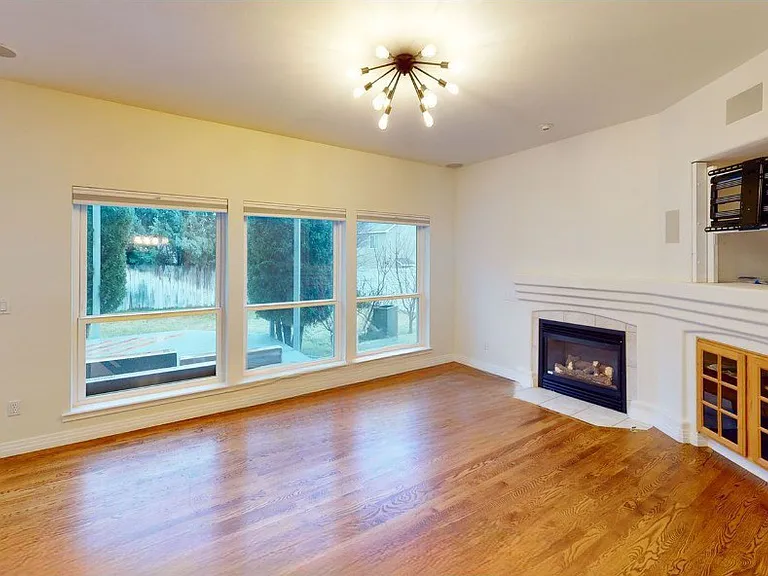 Family room w/ gas fireplace and entertainment center