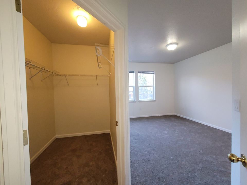 Primary bedroom walk-in closet