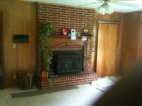 family room with woodburning fireplace