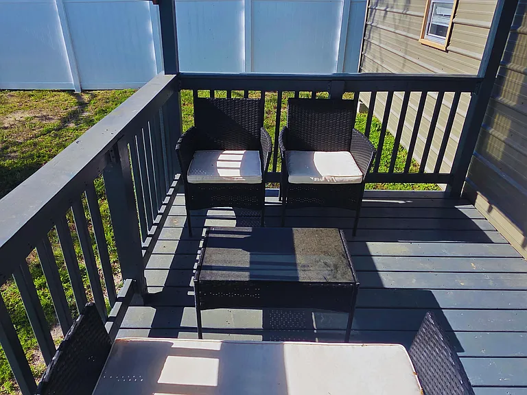 Bright open-air porch perfect for relaxing and unwinding