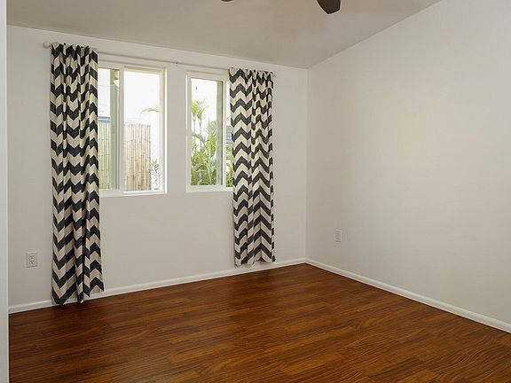 Quiet, cool bedroom with another ceiling fan. Bedroom easily fits a king sized bed, side tables and dresser.