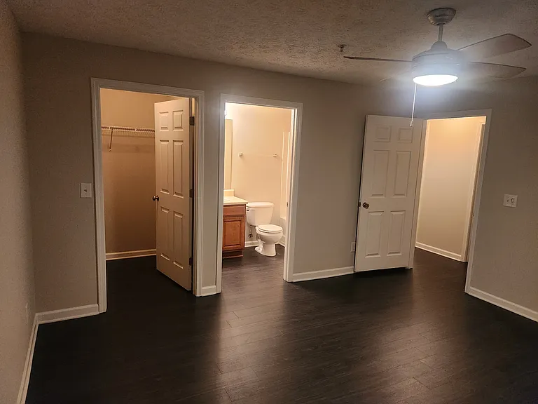 Master bedroom with walk-in closet & in-suite bathroom. Ceiling fan