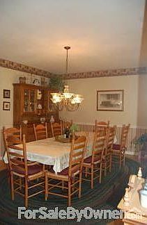 Formal dining room features chair rail.