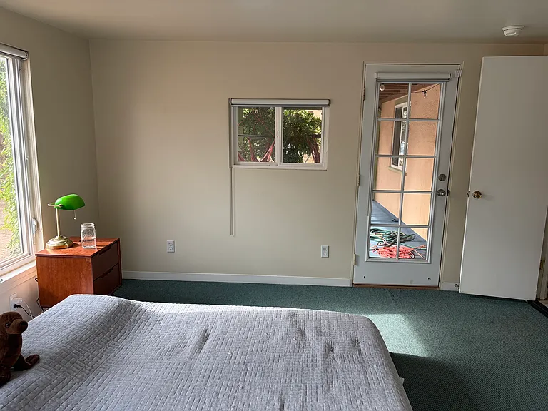 Master bedroom has access leading directly onto patio