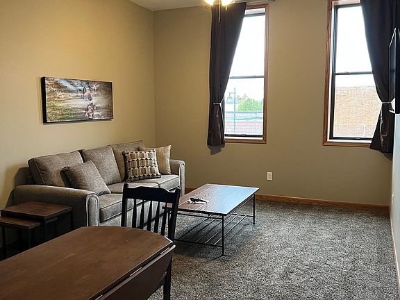 Apt 4 dining area and large living room. Does not show flat screen tv