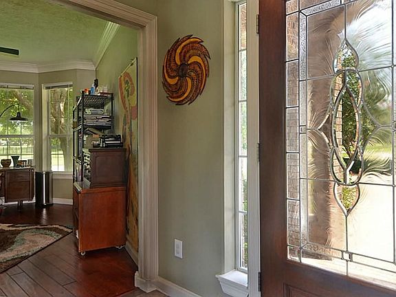 Tuck quietly off the Foyer, the Study will certainly get your creative juices flowing.  Rich, wood floors are joined by stacked Crown Molding to create an inviting and inspiring workspace.