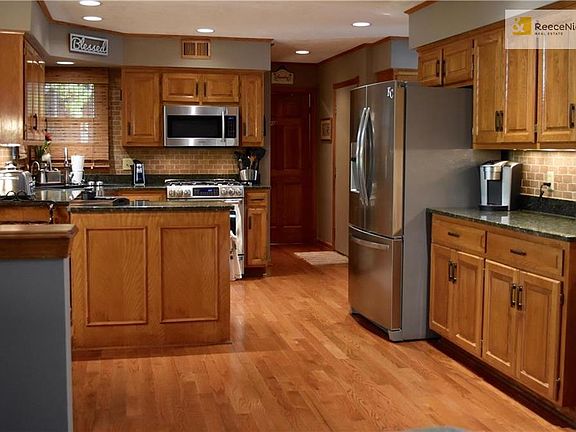 Spacious kitchen with many upgrades and stainless steel appliances.