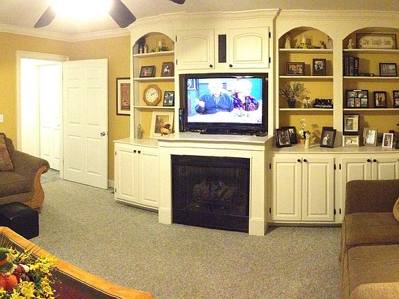 Living Room with Custom Built-in Wall Unit with Gas Logs