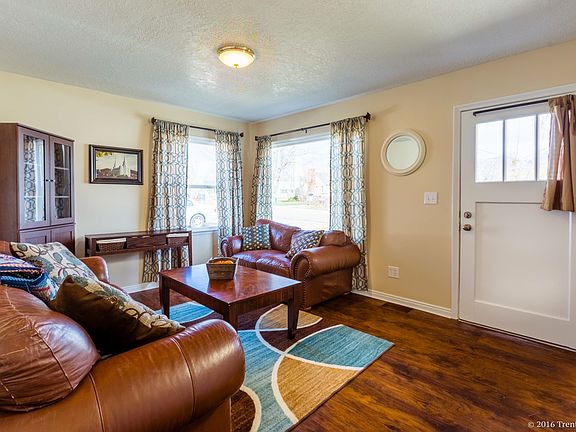Wood-inspired laminate flooring in living room.