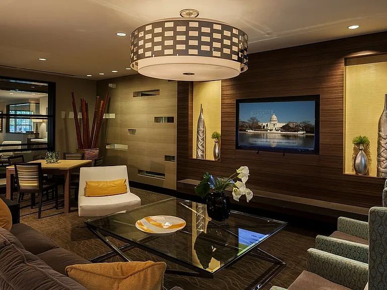 Contemporary Club Room With Bar Area, TV & Numerous Seating Areas