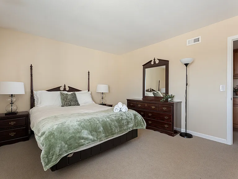 Stylish queen bedroom for restful nights.