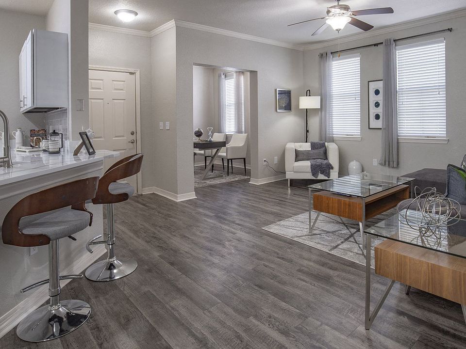 Modern Open Concept Living Room with Breakfast Bar and Wood-Style Flooring