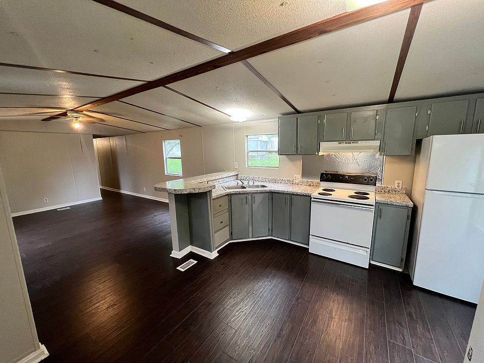 Nice open kitchen and living room. New countertop.