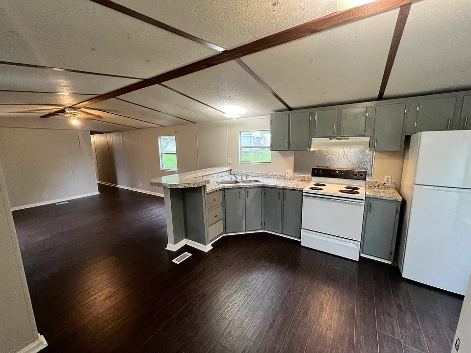 Nice open kitchen and living room. New countertop.