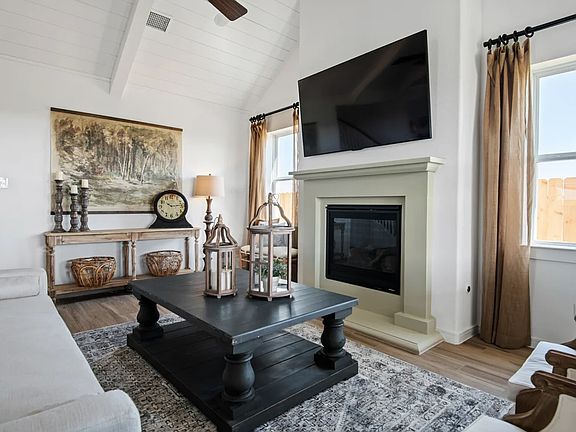Great room with white painted ceiling beams