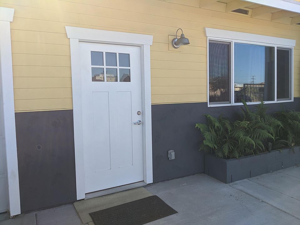 Front door, right next to driveway.