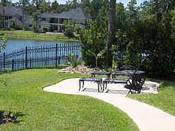 Side private sunning area to enjoy the lake view in your backyard!