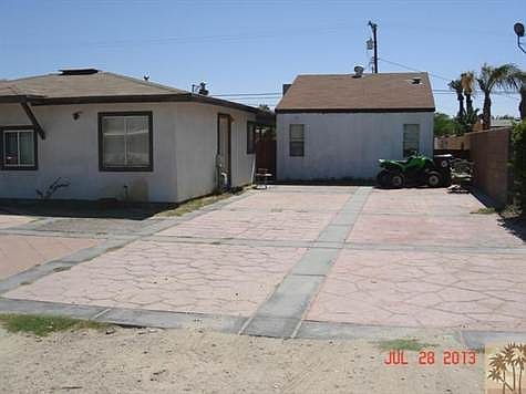 View of unit 2 in back with plenty of parking for RVs or vehicles