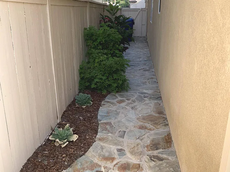 Far end is the gate. Trash bins are stored near the gate
