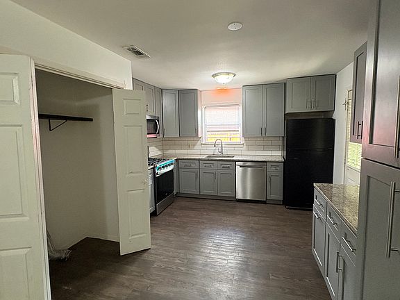 Kitchen with laundry closet to left
