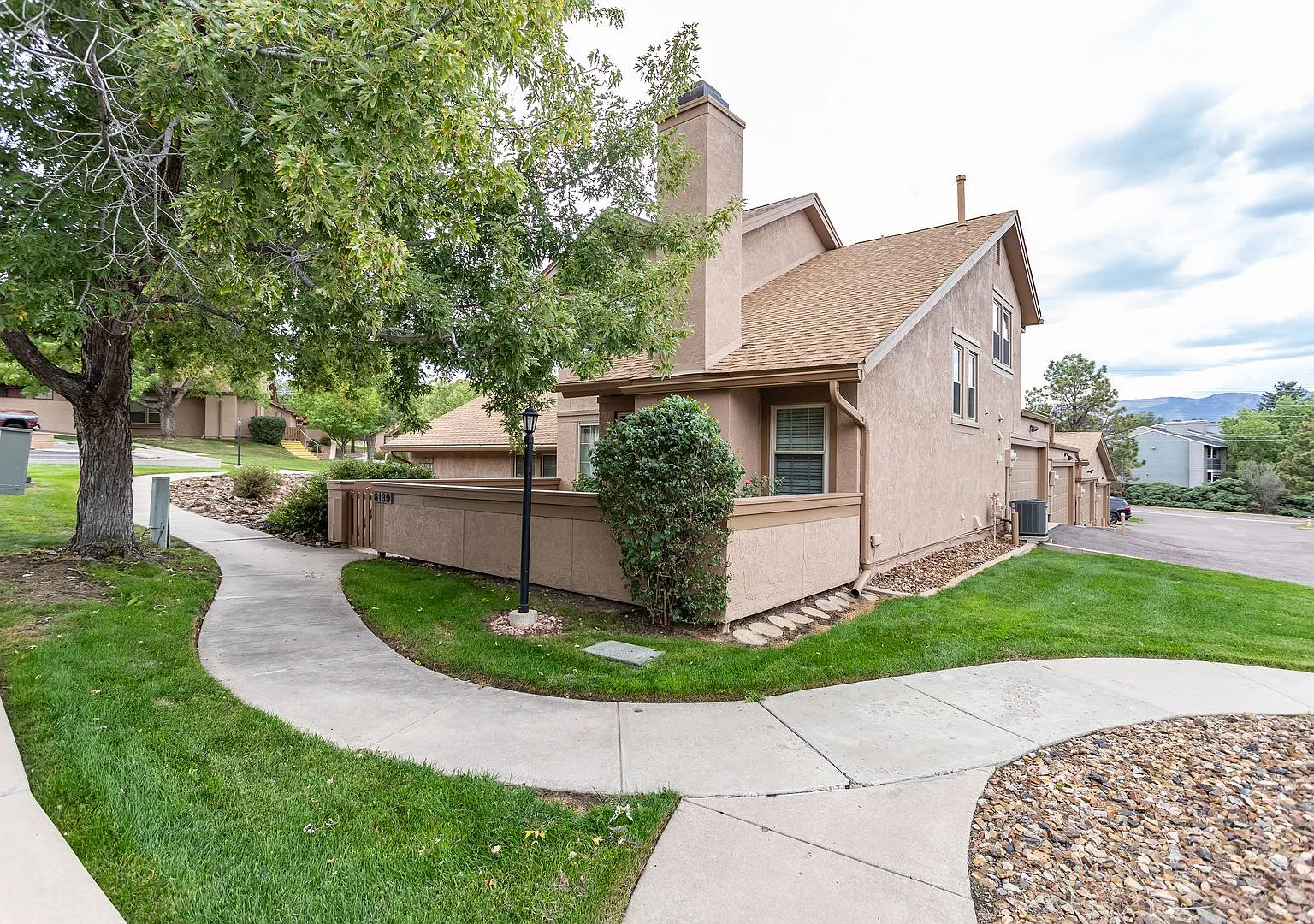 Impeccably Maintained End Unit Townhome with 2-Car Garage: Effortless Comfort & Convenience Await! — Photo 2