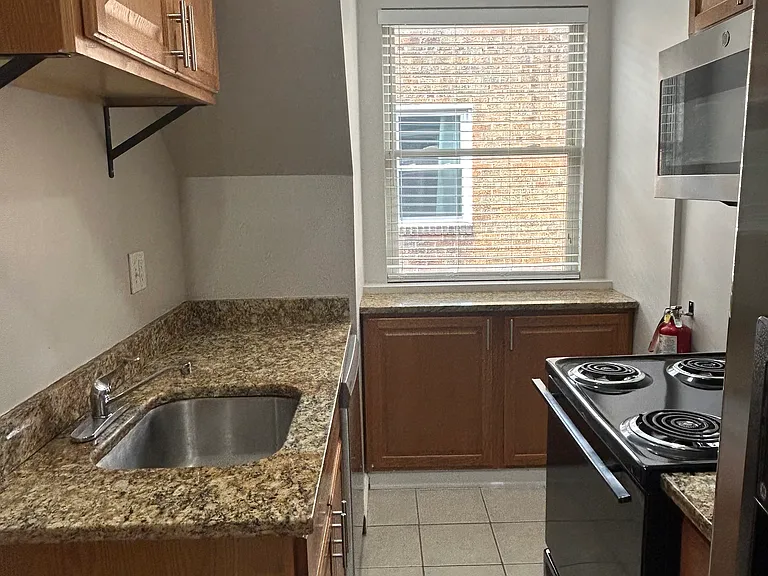 Fully equip Kitchen 
Granite countertops 
Natural light 
(New smooth top stove not in photo)