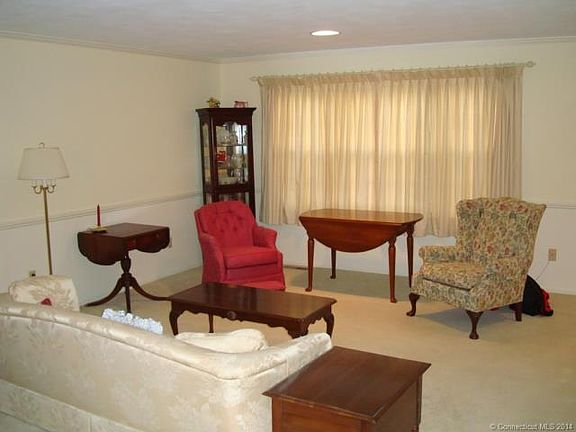 Living Room with Triple Win...