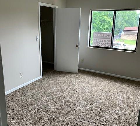 Master bedroom- walk in closet with door open.