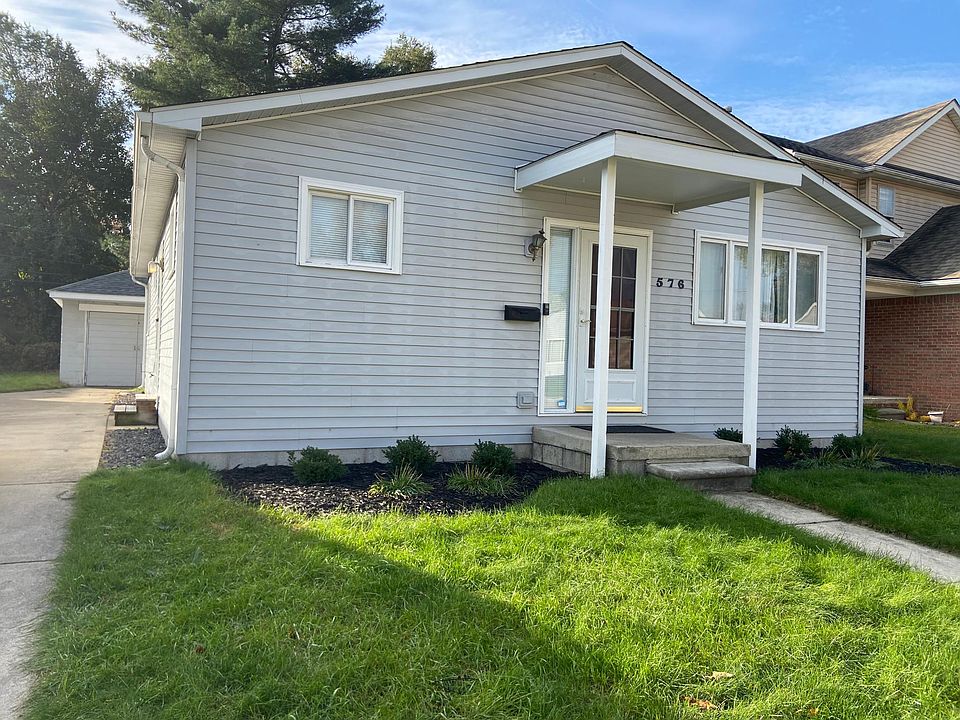Front of House - lots of off street parking and oversized 1.5 car garage with electricity - clean and dry!