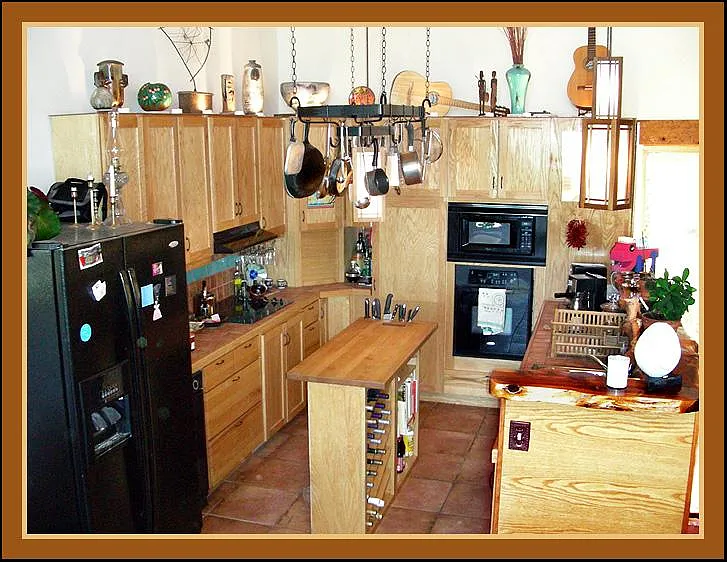 Gourmet Kitchen: L-R Side by side fridge freezer with ice and water, trash compactor, electric range, roll top corner, pantry, microwave, electric oven, toaster oven, air fryer, espresso machine, dishwasher, sink. Totally chef equipped.