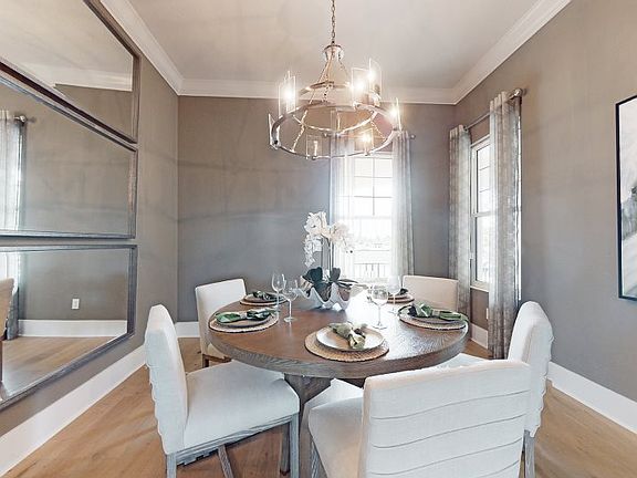 This formal dining room is well equipped for important events and family celebrations, offering a mo
