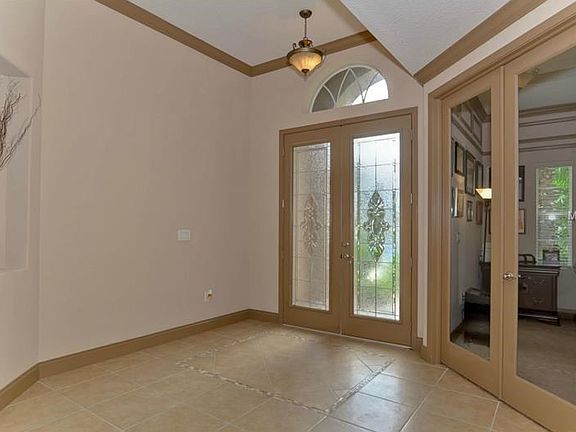 Leaded glass front doors/custom tile foyer/private office