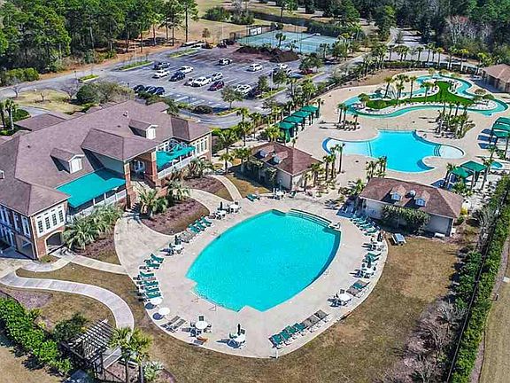 Tuscany Resort Clubhouse, two swimming pools, Lazy River, Cabanas, Jacuzzi & Tennis/Pickleball Courts far on the other side of parking lot
