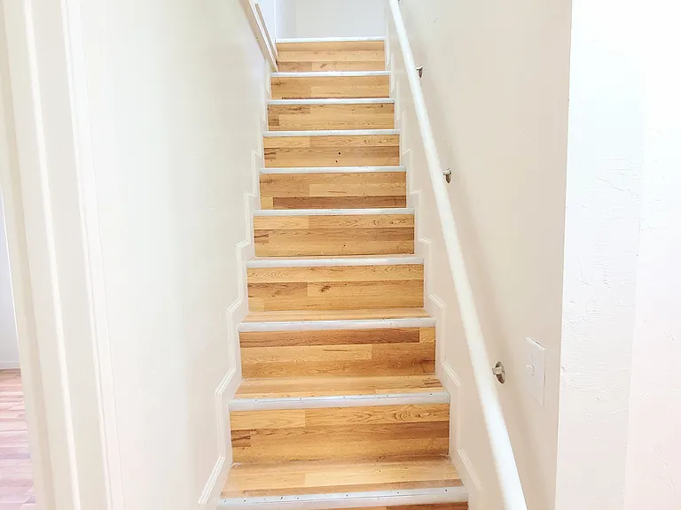 Stairs, the stairs are a little steep, hence we added the handrail, these were the original design in this house.