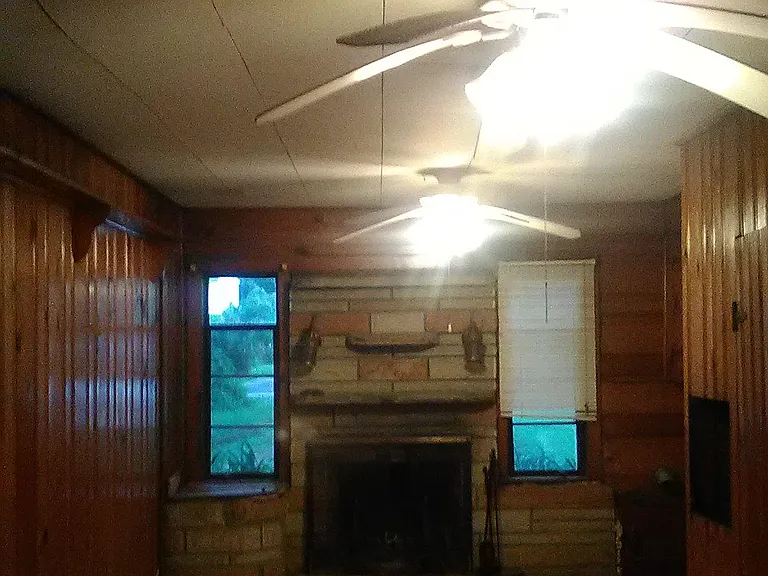 Downstairs 10' x 20' Family Room (knotty pine) with wood burning fireplace. Also, location of laundry appliances and 1/2 bathroom.