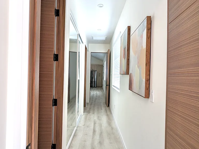 Hallway that leads to 2 bedrooms