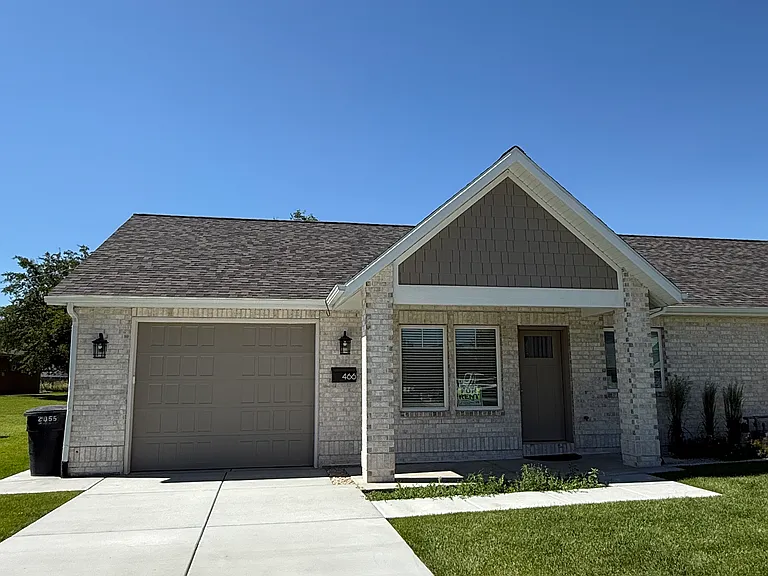 Attached one car garage with concrete driveway