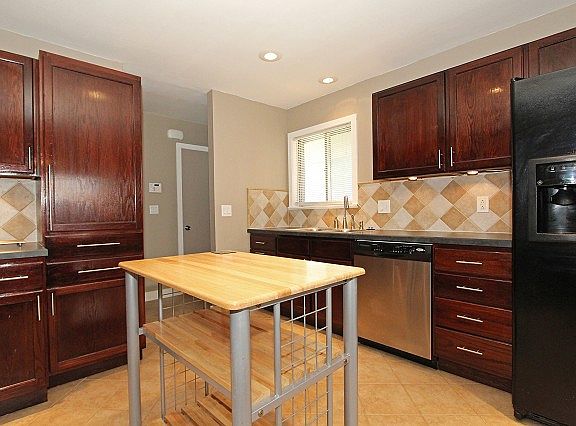 Tile floor and backsplash in kitchen