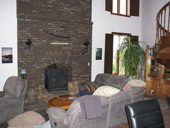 Great Room features 2 story brickwork and wood burning stove
