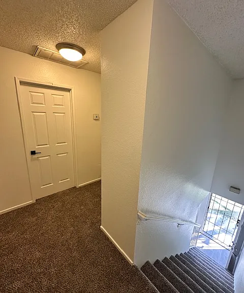 View into hallway from the top of the stairs