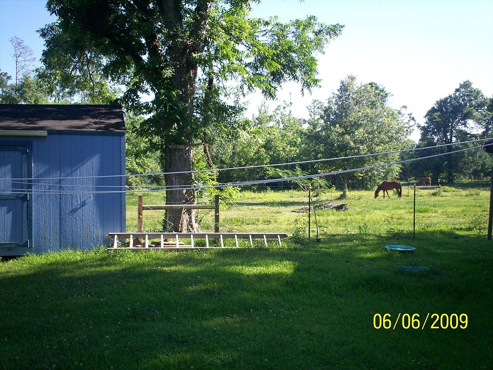 Front pasture & 10X20 storage building