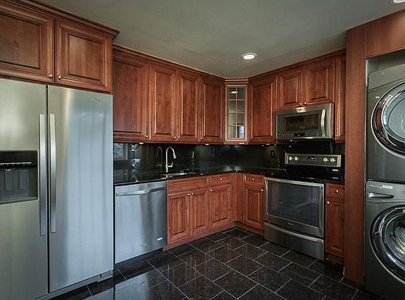 Stainless Steel Appliances. Granite Flooring and Countertops