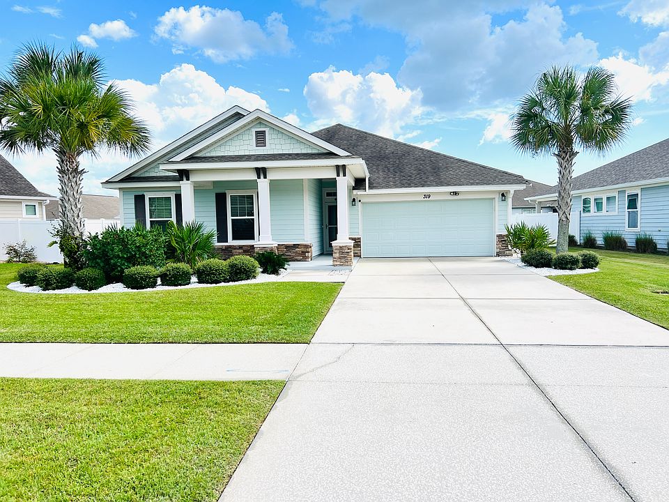 Large lot with a wide driveway offers extra privacy, space between neighbors, and convenience for multiple vehicles.