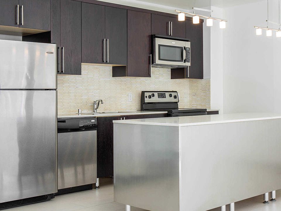 Kitchen with Island and Stainless Steel Appliances
