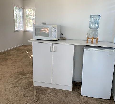 No kitchen, but a refrigerator and microwave are provided for easy dining.